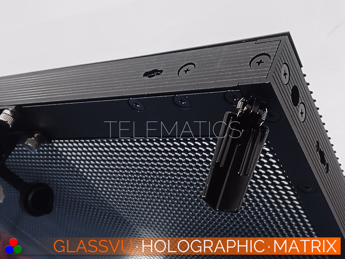 The Art Of Light · GlassVu Matrix · Telematics Canada Bottom corner detail of the GlassVu Matrix transparent LED panel, showing precision alignment pins and durable locking hardware for seamless multi-panel stage connections.