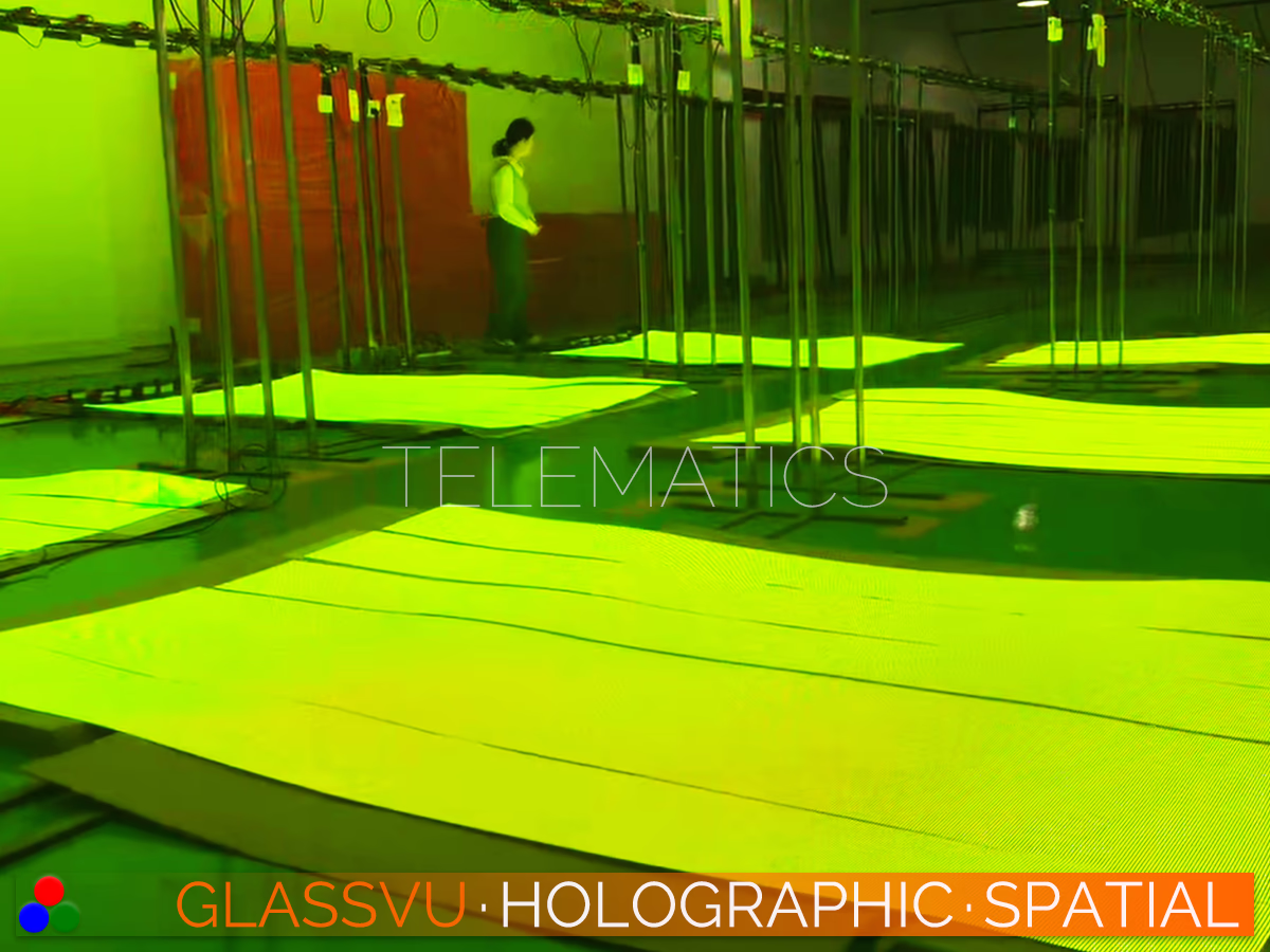 GlassVu Holographic Spatial flexible transparent LED matrices functioning as scalable large-format holographic screens shown during mass factory calibration.